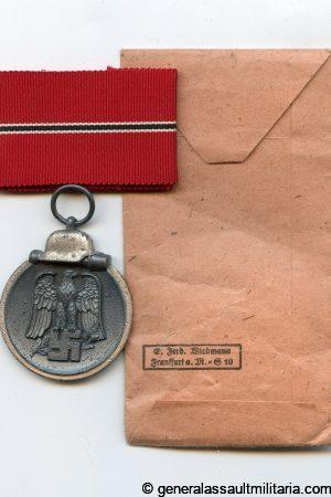 Ost medal + packet - E.F. Wiedmann, Stuttgart
