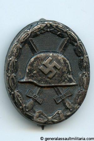 Wound badge in black - MM58 Artur Jakel & Co, Gablonz